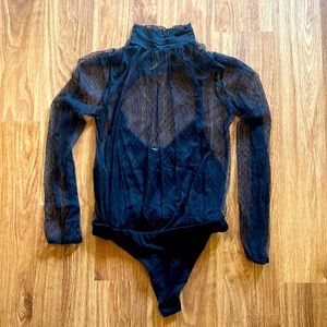 Black mesh turtleneck style bodysuit